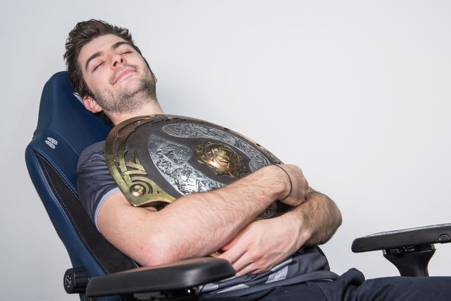 Rest well flowers article image: Ceb resting in a Secretlab chair while holding the Aegis.