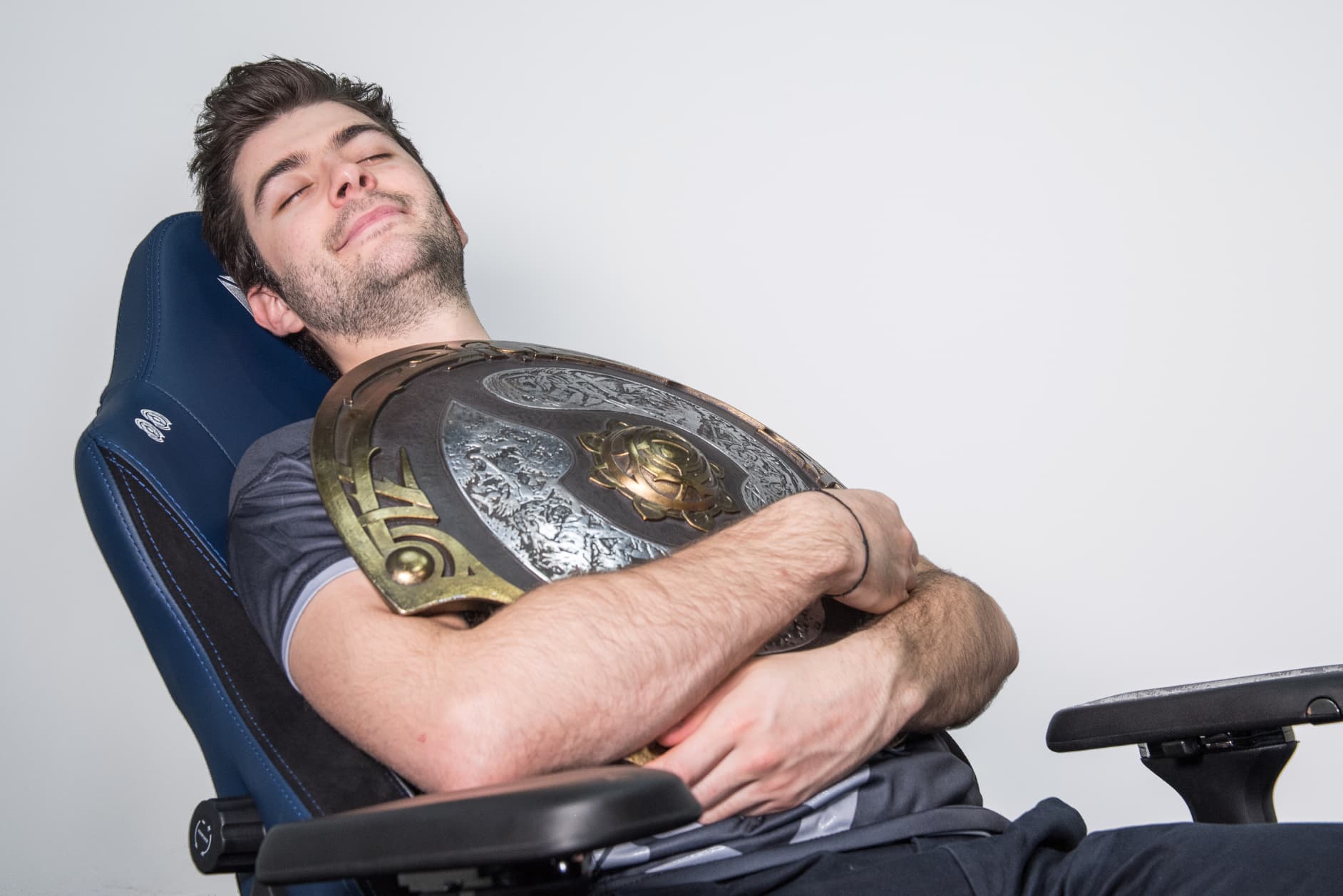 Rest well flowers article image: Ceb resting in a Secretlab chair while holding the Aegis.